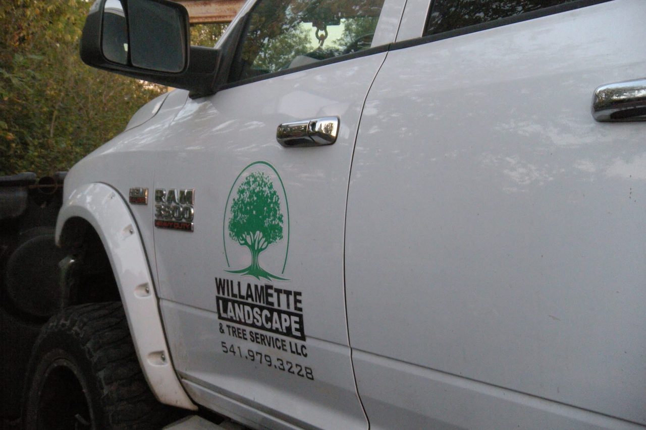 The Willamette truck door carrying the company mark and phone number